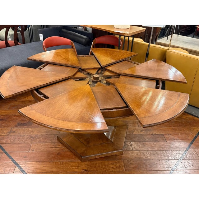 Design Plus Gallery presents the Hobbs Expanding Dining Table from Rose Tarlow. This round dining table showcases a radial...