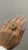 This exquisite ring features a stunning Yellow Sapphire at its center, weighing 13.38 carats, which radiates a warm and...