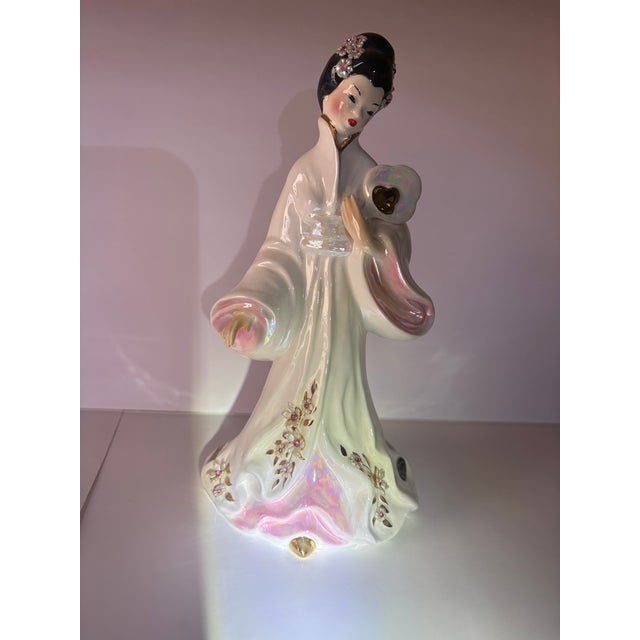 "Cho Cho" and "Sakura" are popular vintage porcelain geisha figurines produced by Josef Originals, primarily during the...