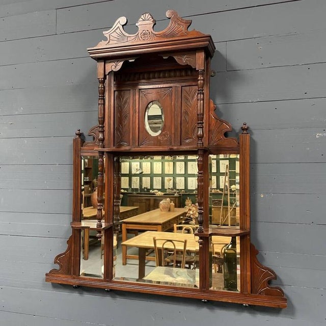 Antique ornate corridor or hall mirror from around 1900. The woodwork of this mirror is richly decorated. The four mirrors...