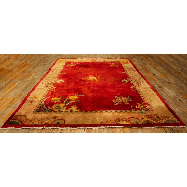A stunning room-sized Antique Chinese Art Deco carpet, circa 1920. This 8' 10" x 11' 5" piece features a vibrant and...
