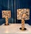 This impressive set of two high quality table lights in brass and velvet was manufactured during the 1970s in Italy....