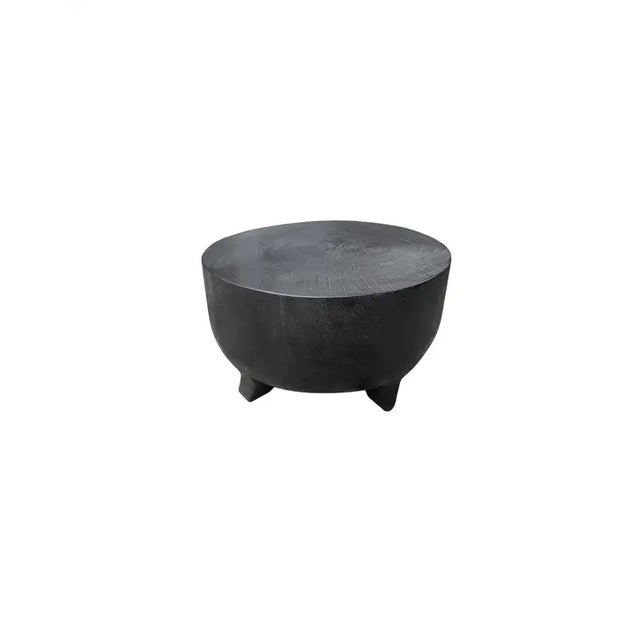 A wonderfully sculptural round side table elevated on four, low and curved legs. Its rich black pigment was achieved...