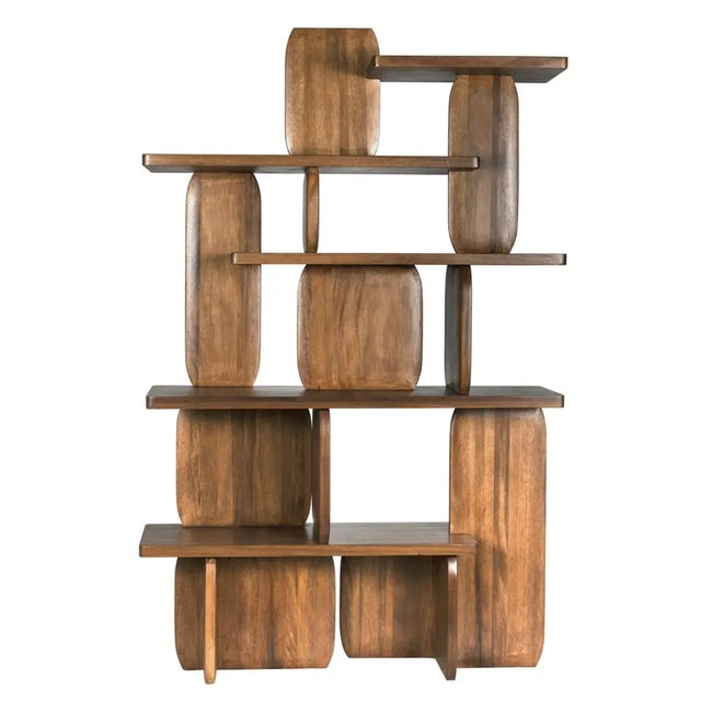 Strikingly carved of dark walnut finished walnut, this unique bookshelf from Noir features geometric shapes offset to...