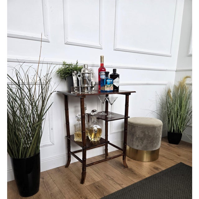 Very elegant Italian dry bar side table in typical Mid-Century faux bamboo shaped wooden legs with its beautiful wood...