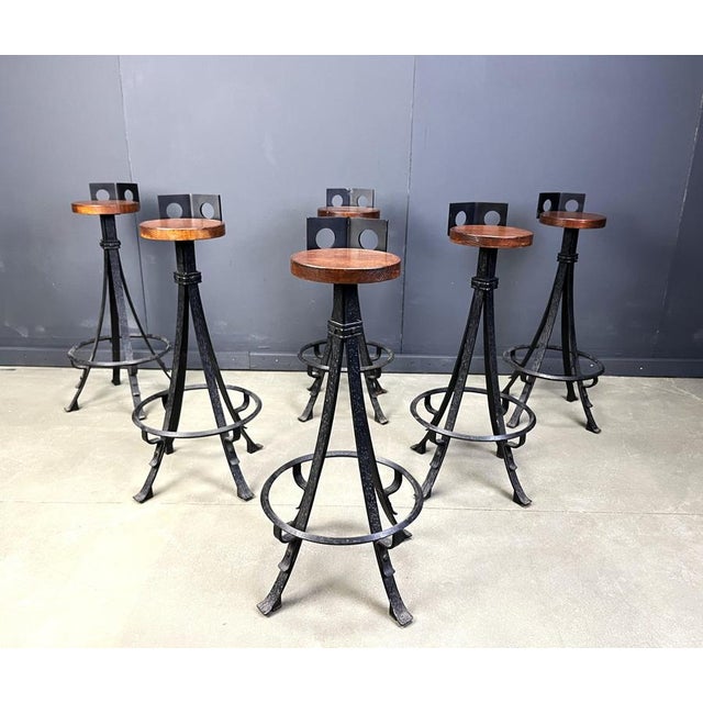 Vintage brutalist bar stools with solid wooden seats and beautifully crafted wrought iron bases. 1960s - Germany Very...