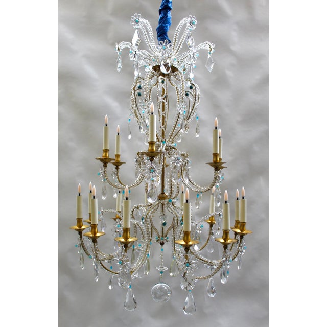 An exceptional Bagués chandelier from the 1960s, crafted from gilded wrought iron and inspired by elegant 18th-century...