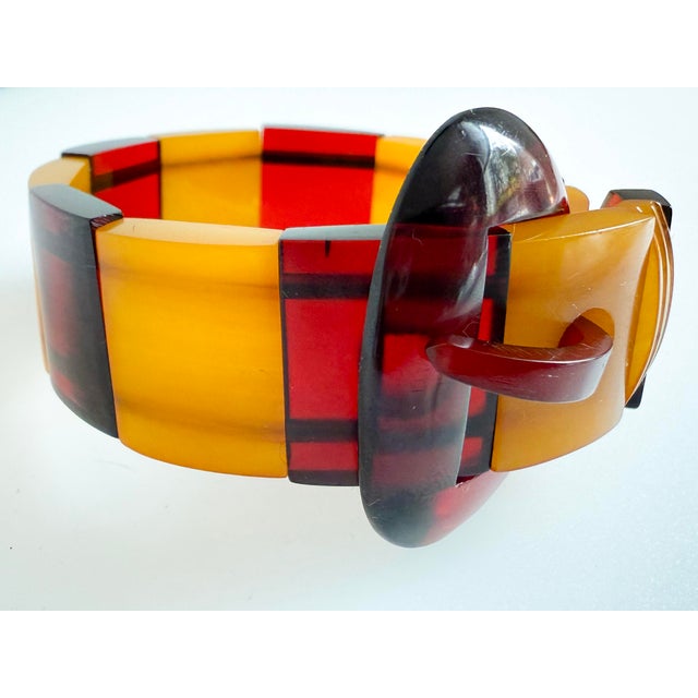 A rare and collectible 1940s two-tone color combination, cherry juice and butterscotch, Catalin Bakelite panel bracelet...