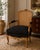 A beautifully proportioned French Louis XV–style bergère armchair featuring an original carved wood frame, elegant...