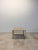 Italian travertine top side table on brass frame with patinated metal outside edges and bronze finish interior edges by...