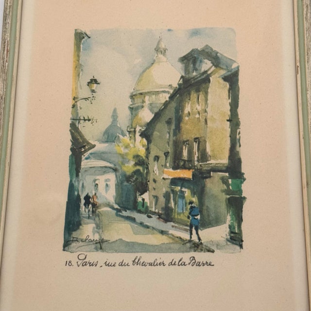 A charming vintage view of Montmartre rendered in a wonderfully subdued palette of sage, blue, ochre and cream. The...