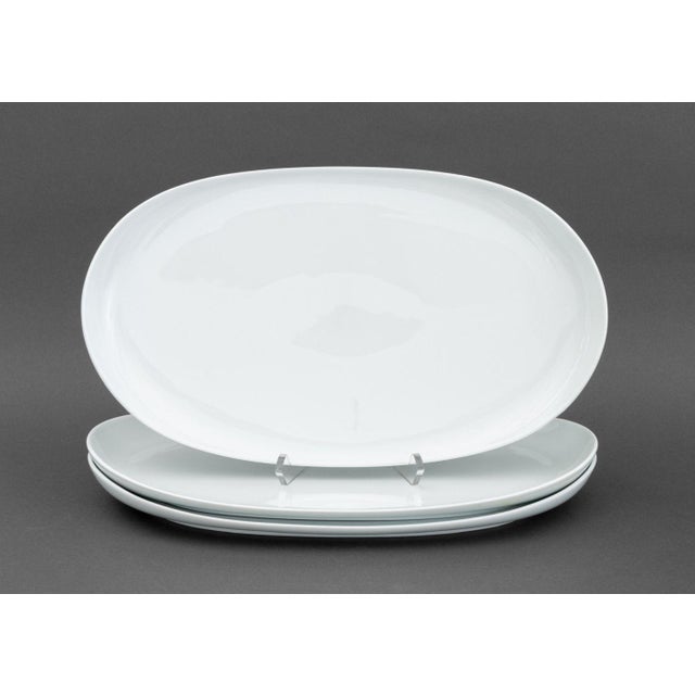 Nambe Ceramic Tableware Set, all marked "nambe / microwave safe / dishwasher safe / Made in Germany" to underside, and...