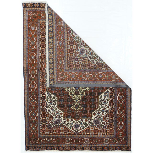 Although this finely knotted scatter is a Southwest nomadic creation, it has many of the features of a more refined city...
