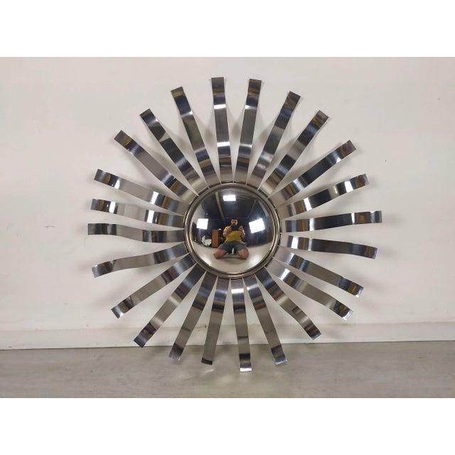 Wavy stainless steel sun mirror, distributed around 1970 by rock Bobois France. Diameter of the mirror curved 18.5cm This...