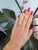 A 1.76-carat padparadscha sapphire glows in its signature pink-orange, set east-west at the centre of this solid 14K white...