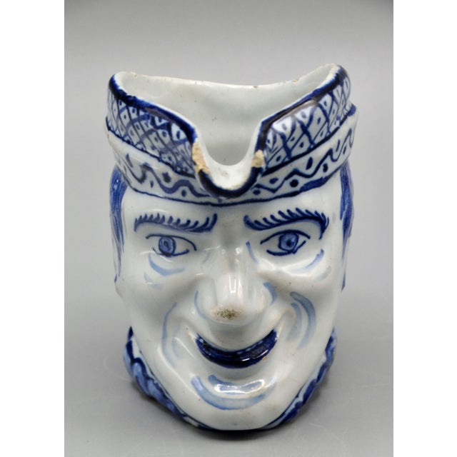 Late 19th-Century Delft jug hand painted in blue and white. This figural pitcher is modeled as a man and is similar to...