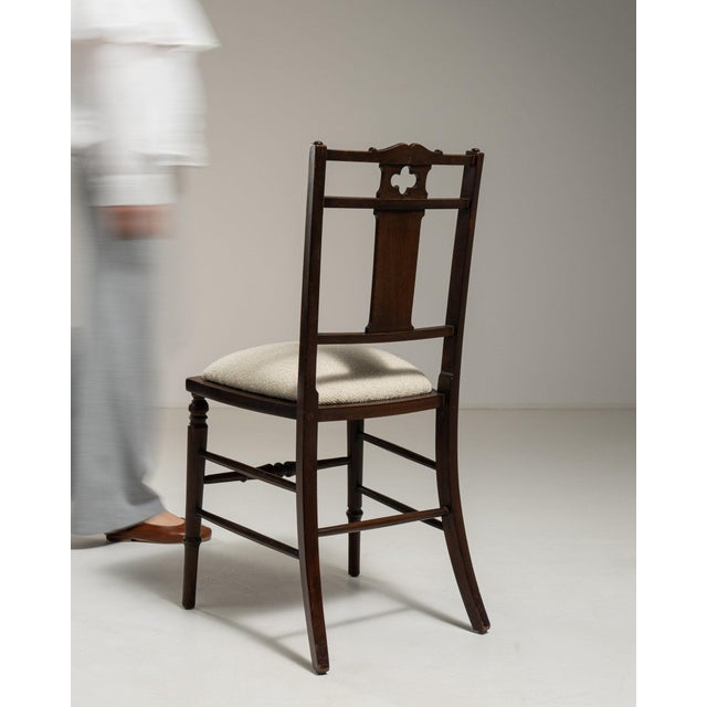 This piece presents as a dining chair, distinguished by dark walnut with inlaid marquetry floral. Dating to 19th Century...