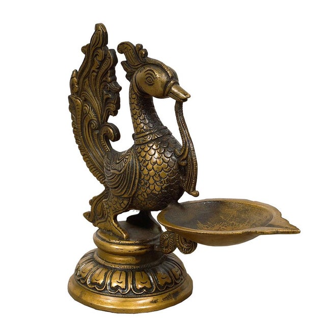 Look at this Vintage Chinese Brass Candle-holder. It is all hand made and hand carved brass bird shaped candle-holder...