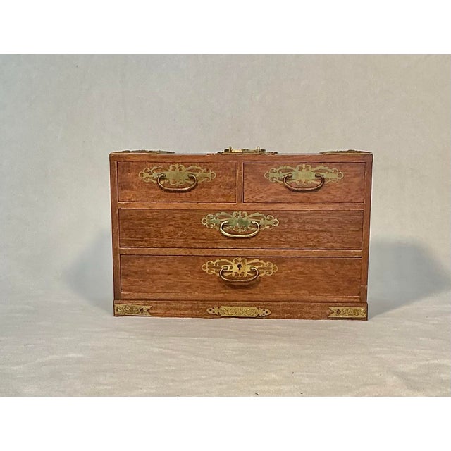 Vintage, made in Japan Tansu jewelry box/chest wood with mounted brass prunus blossom hardware and 4 blue felt lined...