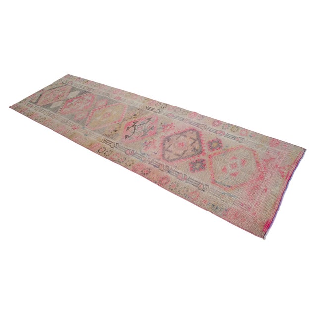 Woven in Southeastern Anatolia during the 1960s, this hand-knotted runner rug exemplifies the enduring appeal of authentic...