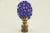 Lamp finial crafted from a colorful millefiori glass lozenge mounted on an antiqued brass base. Sized to fit a standard-...