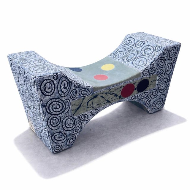 Solid and commanding, this ceramic bench carries a deep grey-black ground with a distinct linear energy running through...