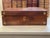 An elegant 19th-century English portable writing slope or lap desk in richly figured mahogany, ornamented with brass...
