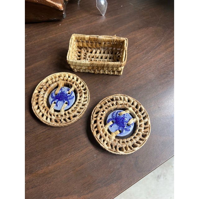 Up for consideration is a beautiful vintage set of blue ceramic crab coasters with wicker edges and basket. This would...