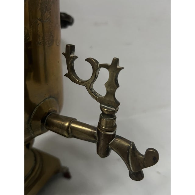 Antique Russian samovar in yellow copper Two wooden handles Bearing hallmarks on the body, base, and top Good condition...