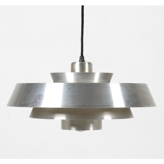 Saucer pendant light designed by Jo Hammerborg for Fog & Morup, Denmark, circa 1970s. Features a brushed metal finish with...
