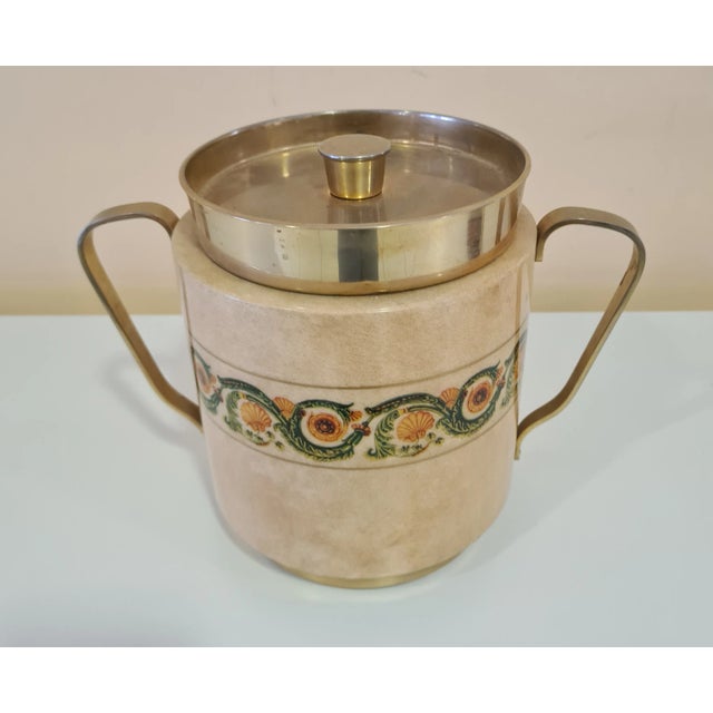 Ice bucket designed by designer Aldo Tura for Macabo. Refined ice bucket made of wood covered in parchment with decorative...