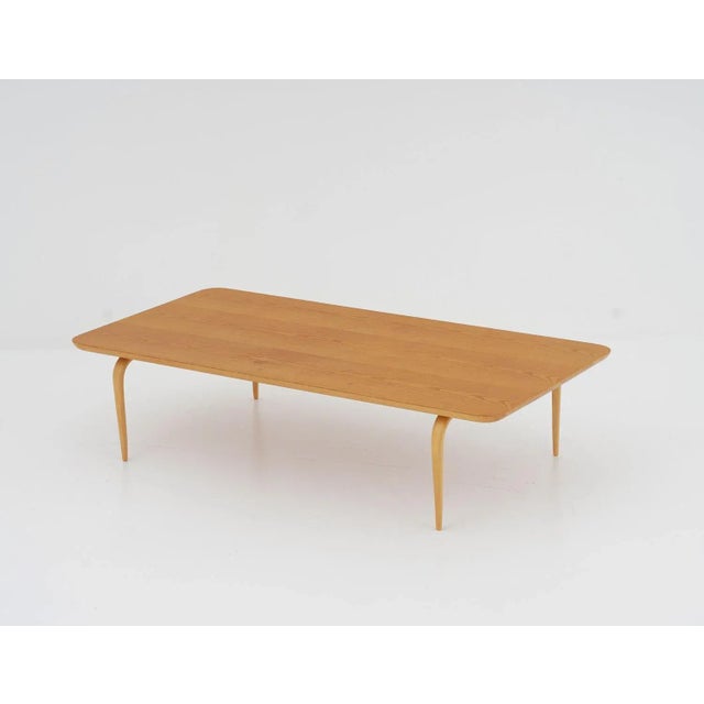 Rare birch coffee or side table by Bruno Mathsson, Sweden. The slim curved legs are significant for Mathsson’s designs and...