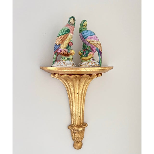 An important and visually commanding pair of Continental porcelain parrot figurines, executed in the grand tradition of...