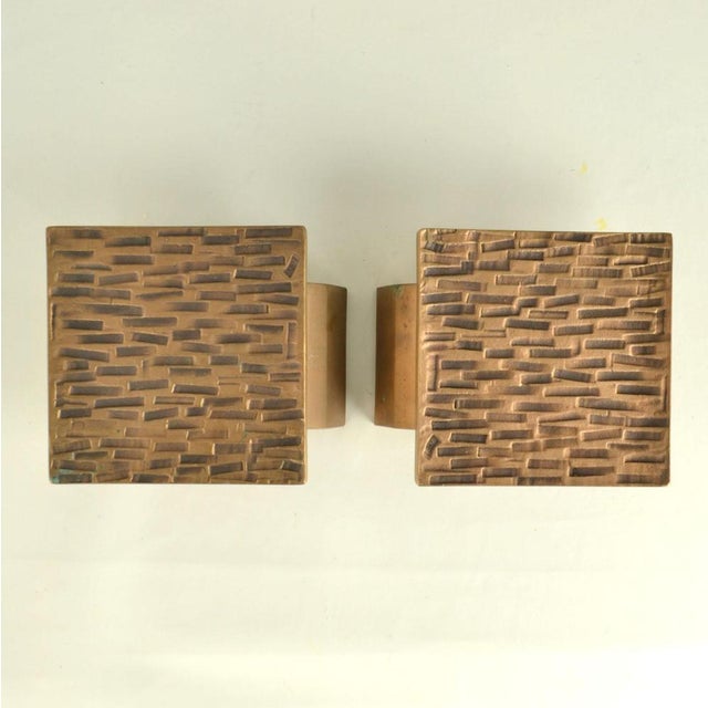 Brutalist pair of bronze relief with subtile geometric pattern with repetition of embossed rectangles is made in the...