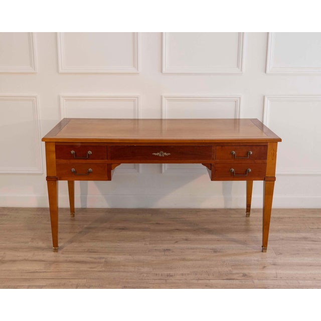Elegant Louis XVI style bureau plat crafted in mahogany, dating to the mid-20th century and inspired by late 18th-century...