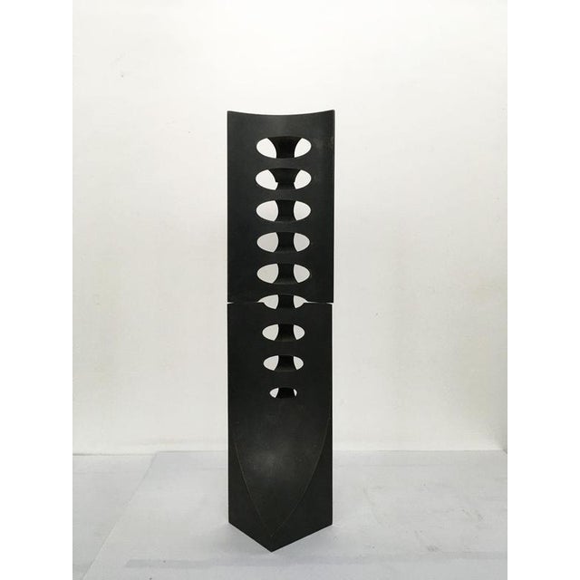 This intense and engaging abstract bronze sculpture was created by the Italian artist Roberto vecchione. The title "...