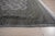 A hand-knotted wool rug, made in India and measuring 4' x 6'. Floral drawing carried across the field inside a traditional...