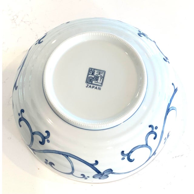Chrysanthemum flower design interior with a scroll design on outer bowl. Set of 2 matching bowls.