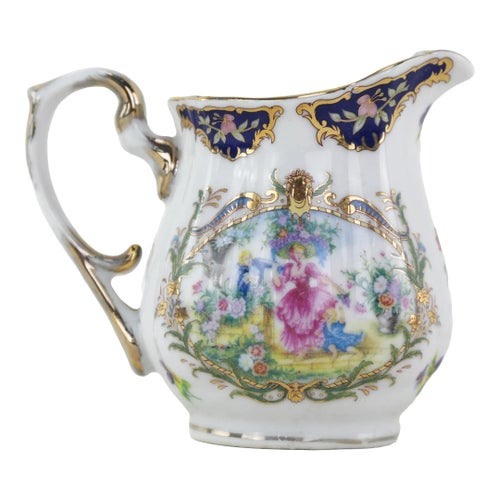 Elegant Victorian Porcelain Creamer With Ornate Blue and Gold Floral Design