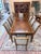 A distinguished 9-piece dining set from Ethan Allen’s celebrated Goodwin Collection, blending formal American...