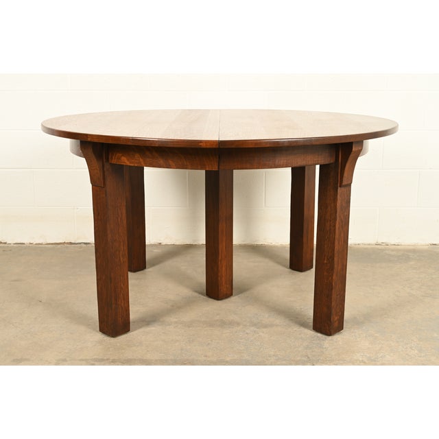 An outstanding antique Mission or Arts & Crafts period quarter sawn oak five-leg extension dining table By Charles P....