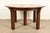 An outstanding antique Mission or Arts & Crafts period quarter sawn oak five-leg extension dining table By Charles P....