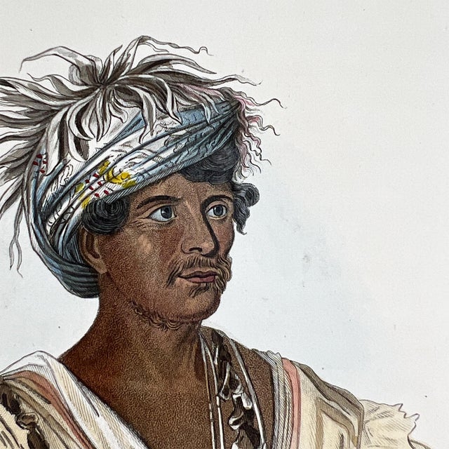 A striking mid-19th century hand-colored engraving depicting “Tuch-ee, Chef de Guerre Cherokee”, a Cherokee war chief,...