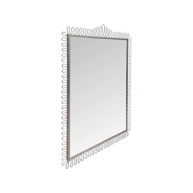 This Squiggle Mirror makes a statement with its playful looping frame and softly organic shape, bringing movement and...