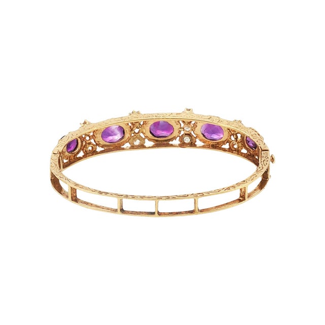 This mid-century bracelet is crafted in 13k gold. The design features oval-cut amethysts in a rich purple hue,...