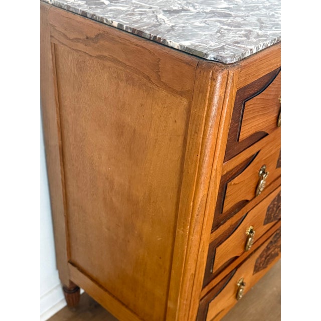 An exceptional French Art Deco period commode (chest of drawers), circa 1930, featuring four spacious drawers. This piece...