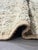 Vintage Beni Mguild Rug – Handmade Moroccan Wool Rug This beautiful vintage Beni Mguild rug features a softly faded...