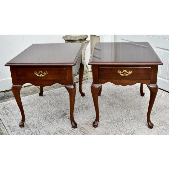 Vintage (1980's) Pair of Side/End Tables have a Queen Anne Style. Made by Thomasville Furniture. The Wood is Mahogany. The...