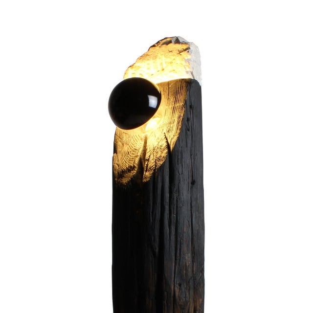The Totem Lamp is a hand-crafted wood and stone floor lamp from the Raw Collection by Gabor Gobi, built from a repurposed...