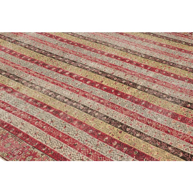Hand knotted in wool and originating from Turkey circa 1880-1890, this 9x10 antique rug hails from the Ghiordes region of...